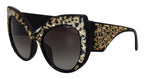 Dolce & Gabbana black and gold sequin butterfly polarized sunglasses with stylish frame and tinted lenses.
