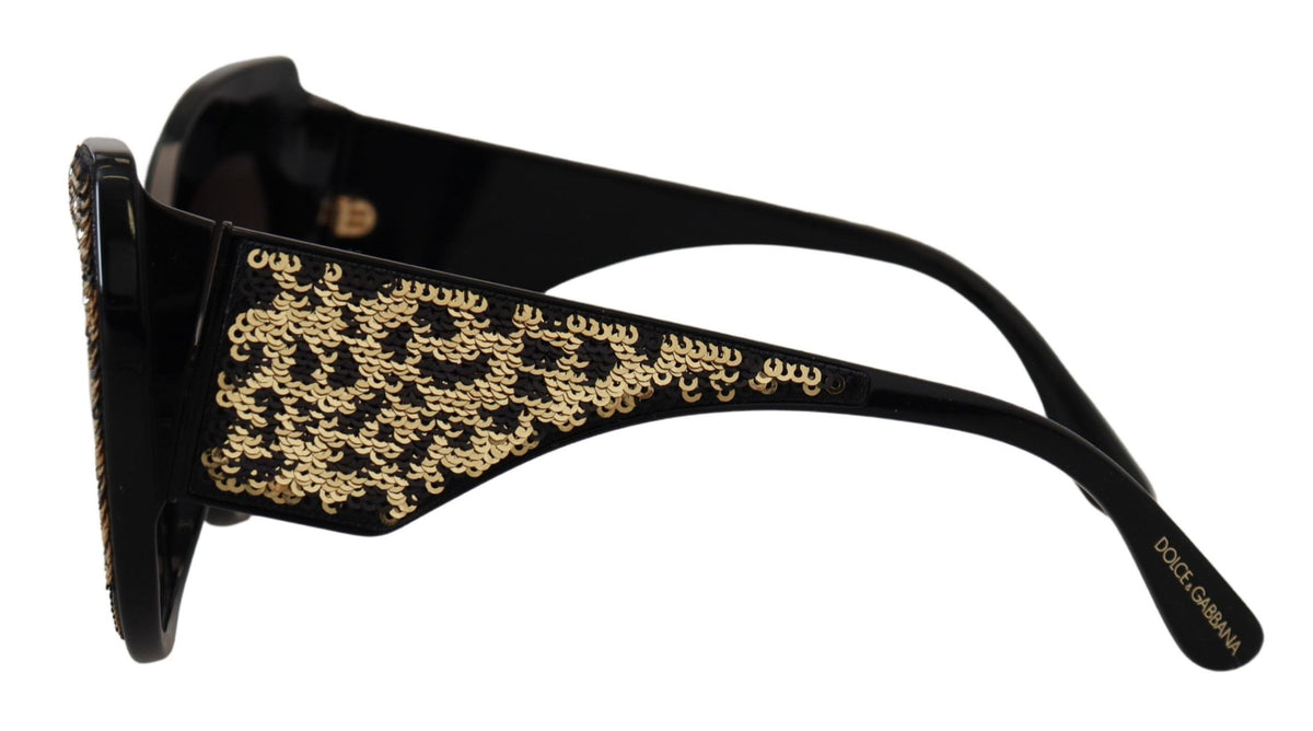 Dolce & Gabbana black and gold sequin butterfly polarized DG4326 sunglasses with stylish frame and reflective lenses.