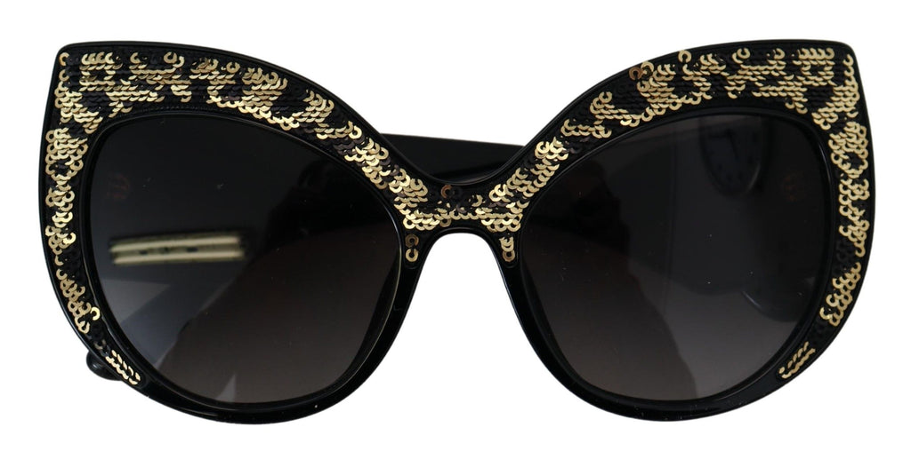 Dolce & Gabbana black and gold sequin butterfly polarized sunglasses with a bold, stylish frame and dark tinted lenses.