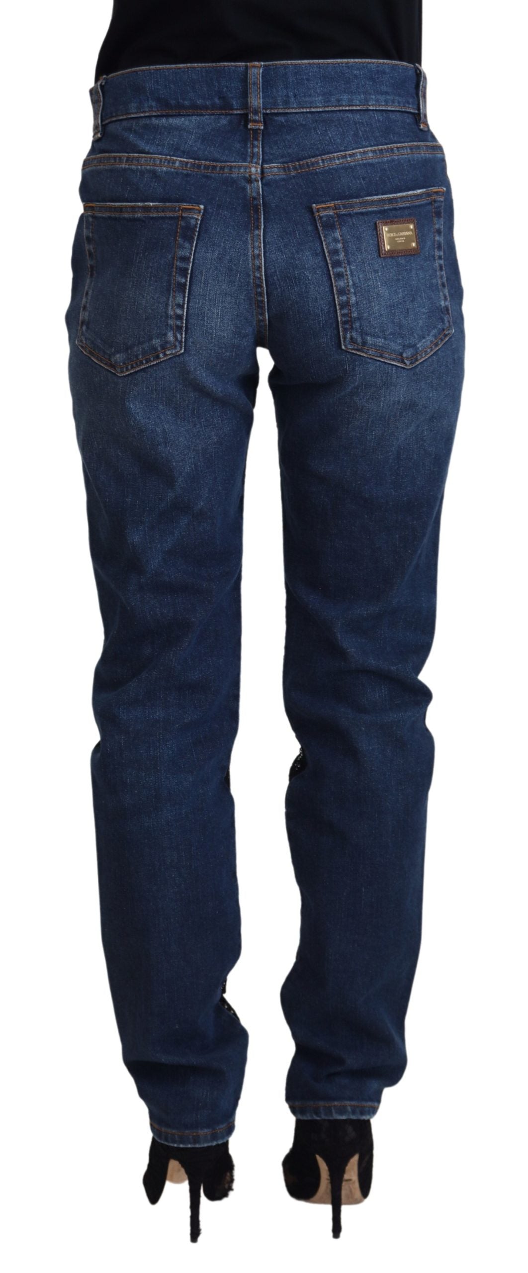 Dolce & Gabbana black floral lace front skinny denim jeans showing floral lace detail and slim fit design.