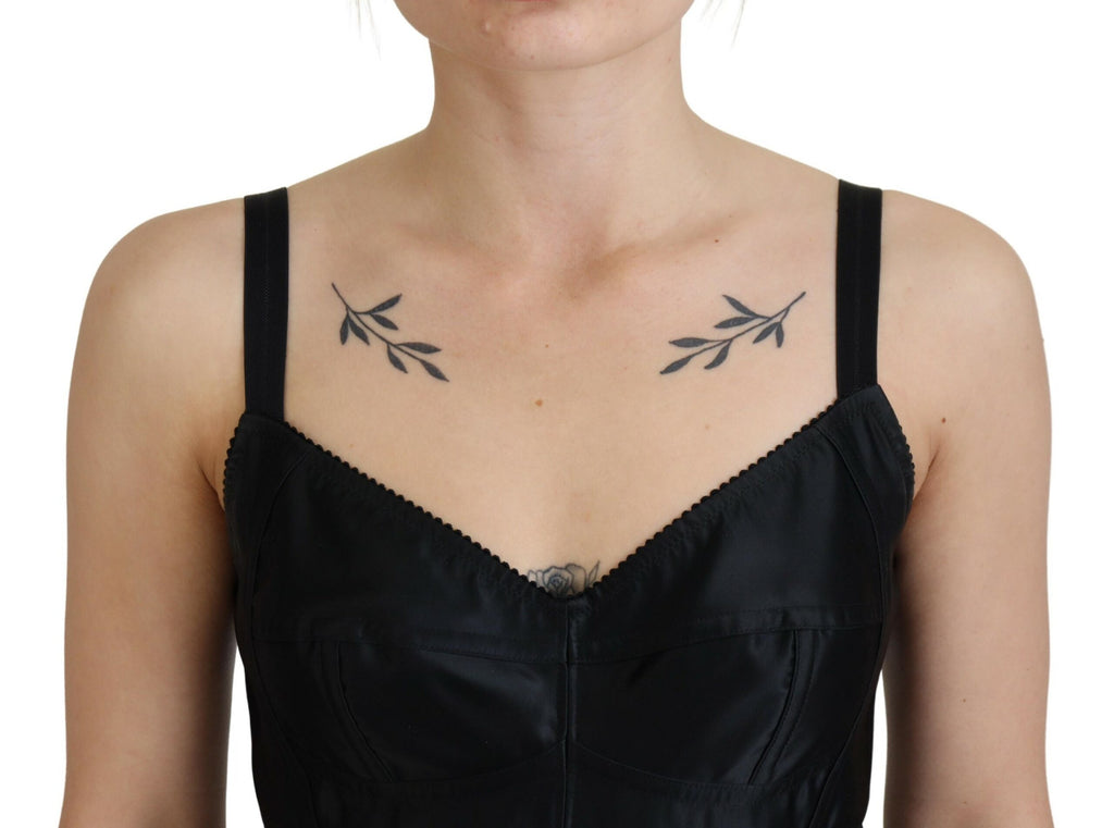 Dolce & Gabbana black fit wool stretch sheath mini dress displayed on a hanger. Elegant, form-fitting designer dress for women.