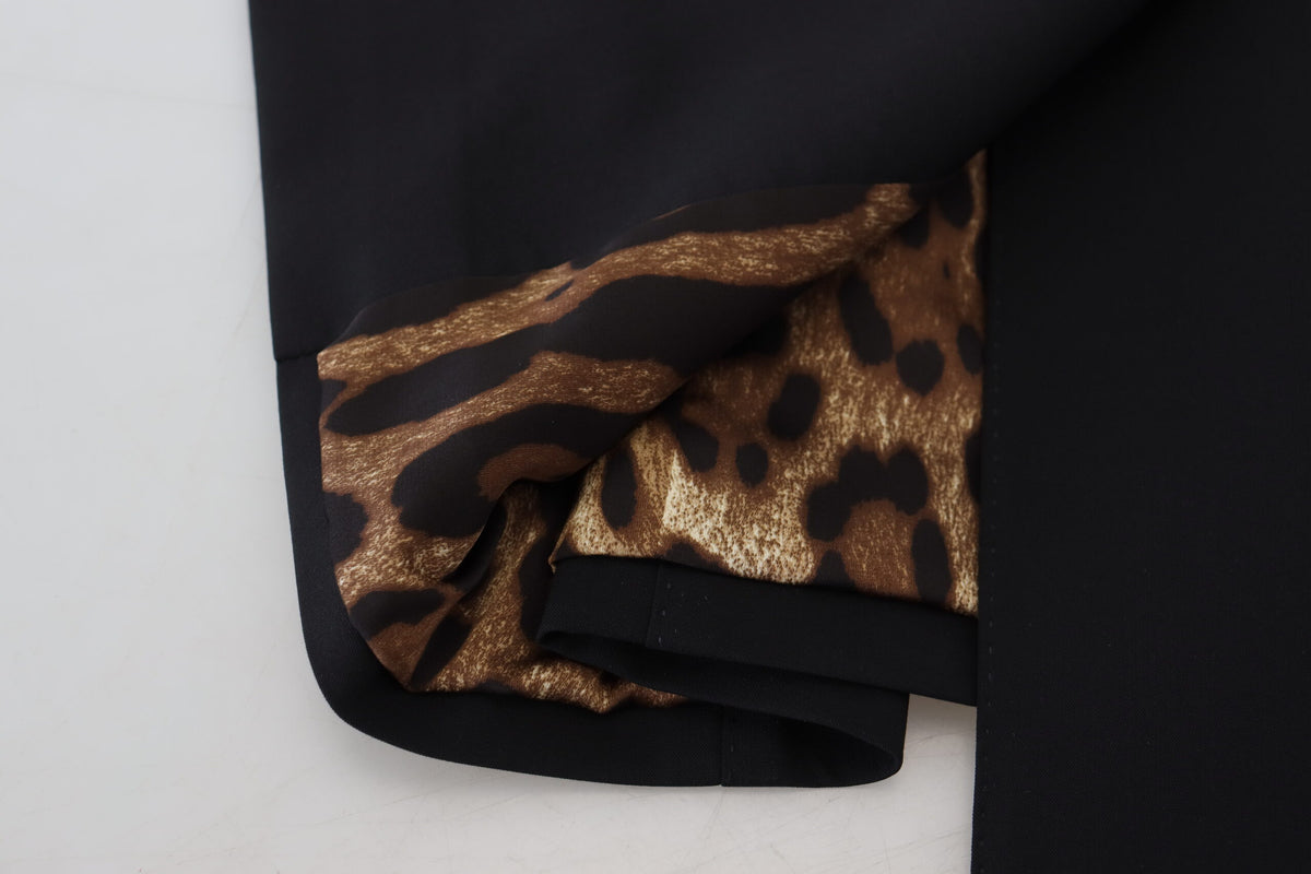 Black Dolce & Gabbana wool stretch sheath mini dress, fitted design with long sleeves and a sleek, elegant silhouette.