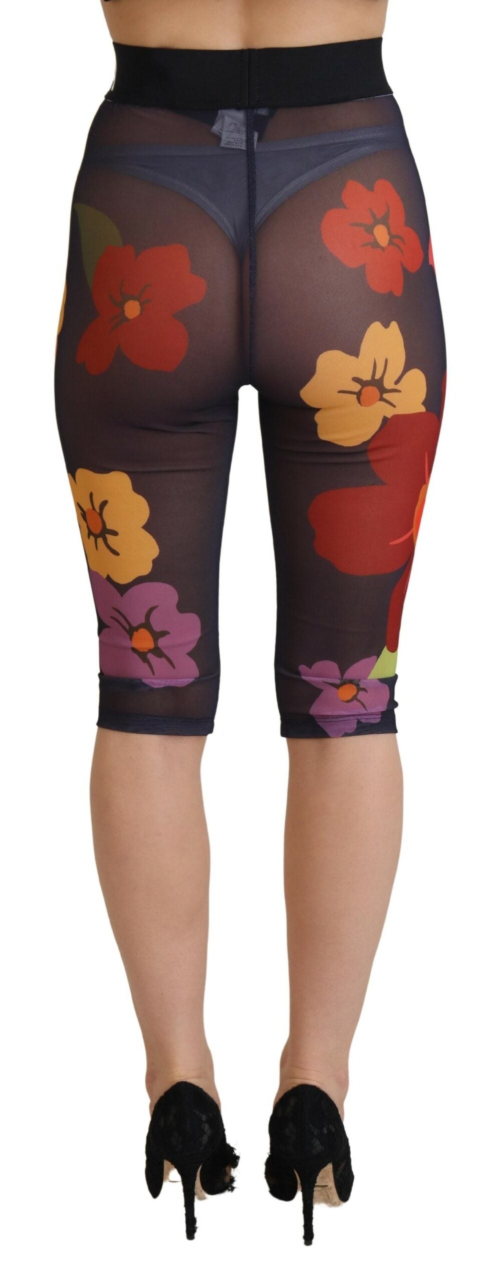 Black floral Dolce & Gabbana leggings with stretch waist and fitted design, shown on a model.