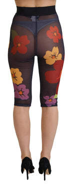 Black floral Dolce & Gabbana leggings with stretch waist and fitted design, shown on a model.