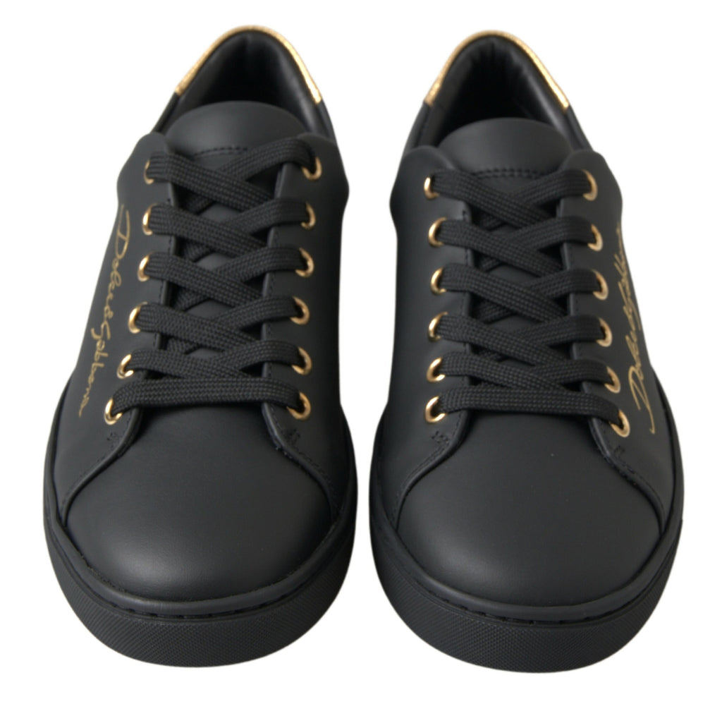 Dolce & Gabbana black leather and gold accents classic sneakers with stylish design and rubber sole.