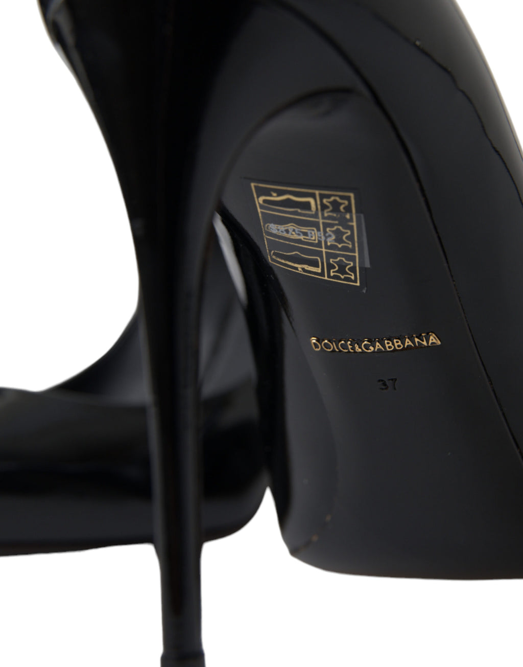 Dolce & Gabbana black patent leather pumps with pointed heels and sleek design, perfect for elegant formal occasions.