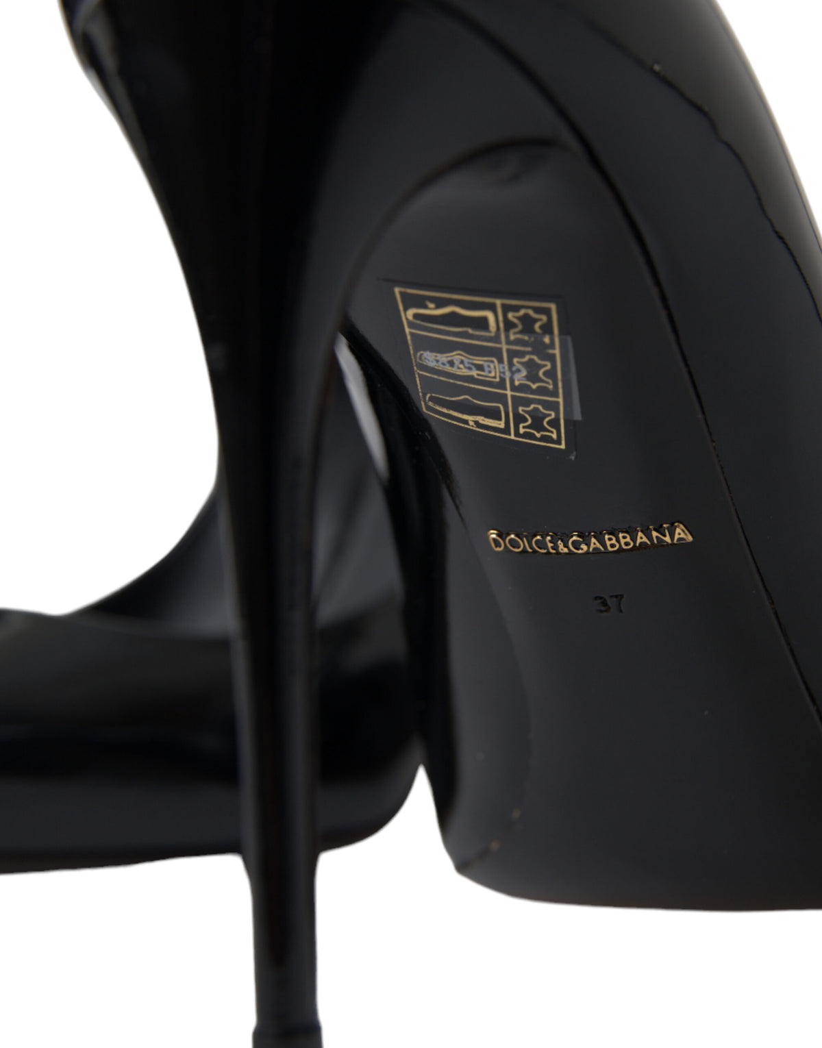 Dolce & Gabbana black patent leather pumps with pointed heels and sleek design, perfect for elegant formal occasions.