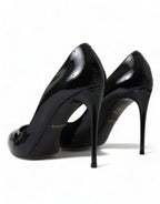 Dolce & Gabbana black patent leather pumps with pointed heels and sleek design, perfect for elegant footwear.