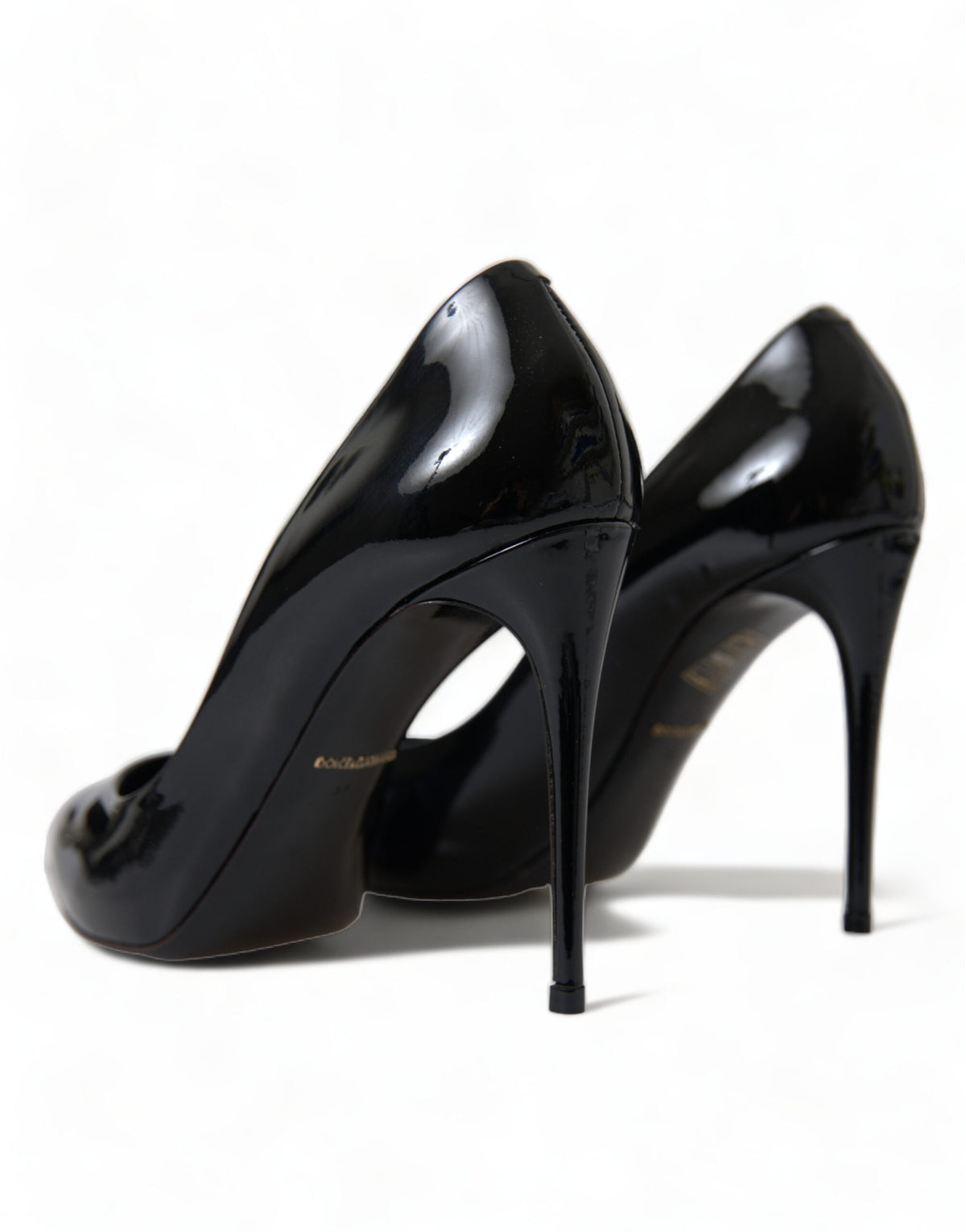 Dolce & Gabbana black patent leather pumps with pointed heels and sleek design, perfect for elegant footwear.