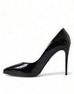 Dolce & Gabbana black patent leather pumps with pointed heels and sleek design, showcasing elegant women's footwear.