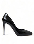 Black patent leather Dolce & Gabbana pumps with pointed toes and stiletto heels, stylish and elegant women's shoes.