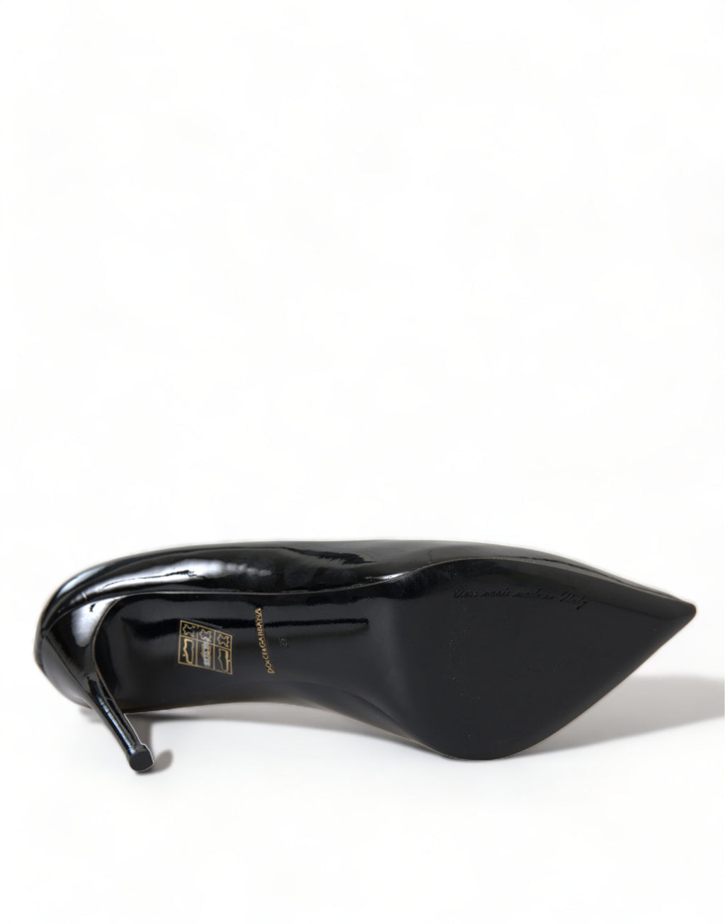 Black patent leather Dolce & Gabbana pumps with pointed toes and stiletto heels, stylish women's shoe fashion.