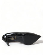 Black patent leather Dolce & Gabbana pumps with pointed toes and stiletto heels, stylish women's shoe fashion.