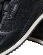 Dolce & Gabbana black floral lace leather sneakers showing detailed floral lace design and sleek leather construction.
