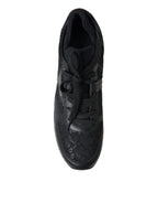 Dolce & Gabbana black floral lace leather sneakers with lace-up design and stylish floral pattern.