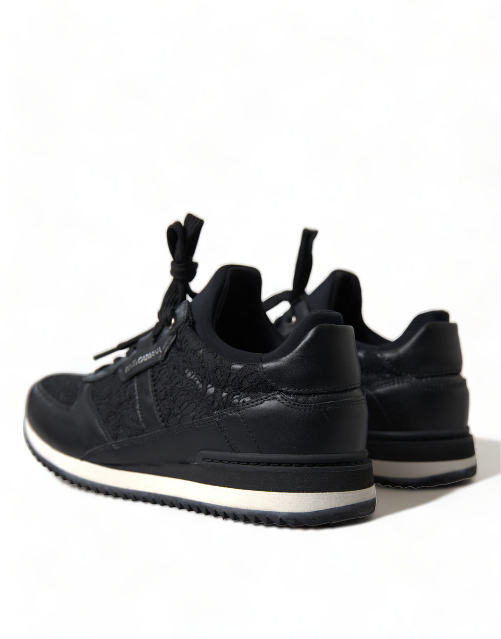 Dolce & Gabbana black floral lace leather sneakers showing detailed lace design and sleek sneaker silhouette.