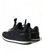Dolce & Gabbana black floral lace leather sneakers showing detailed lace design and sleek sneaker silhouette.