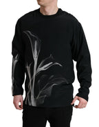 Dolce & Gabbana black floral print crewneck pullover sweater displayed on a model, showcasing stylish casual fashion.