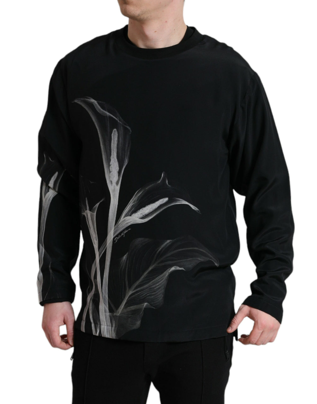Dolce & Gabbana black floral print crewneck pullover sweater displayed on a model, showcasing stylish casual fashion.