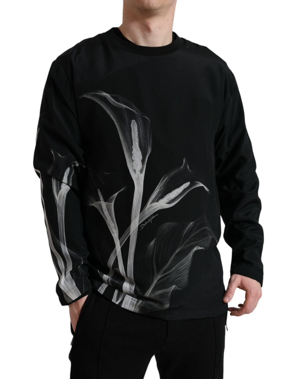 Dolce & Gabbana black floral print crewneck pullover sweater featuring vibrant floral designs on soft fabric.