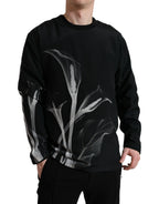 Dolce & Gabbana black floral print crewneck pullover sweater featuring vibrant floral designs on soft fabric.