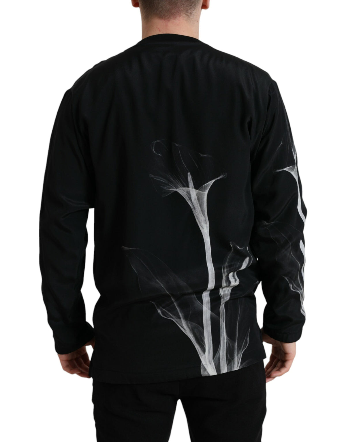 Dolce & Gabbana black floral print crewneck pullover sweater displayed on a hanger, showcasing its stylish design and fabric details.