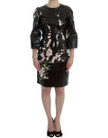 Dolce & Gabbana black floral 3/4 sleeve sheath dress displayed on a mannequin, showcasing elegant design and floral pattern.