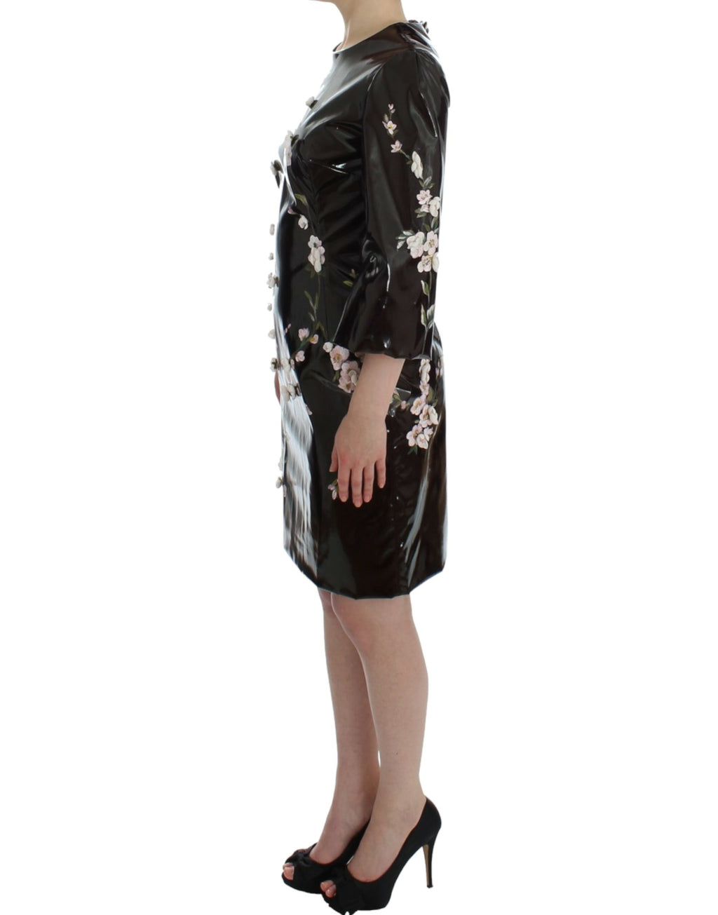 Dolce & Gabbana black floral 3/4 sleeve sheath dress displayed on a hanger, showcasing elegant design and floral pattern.