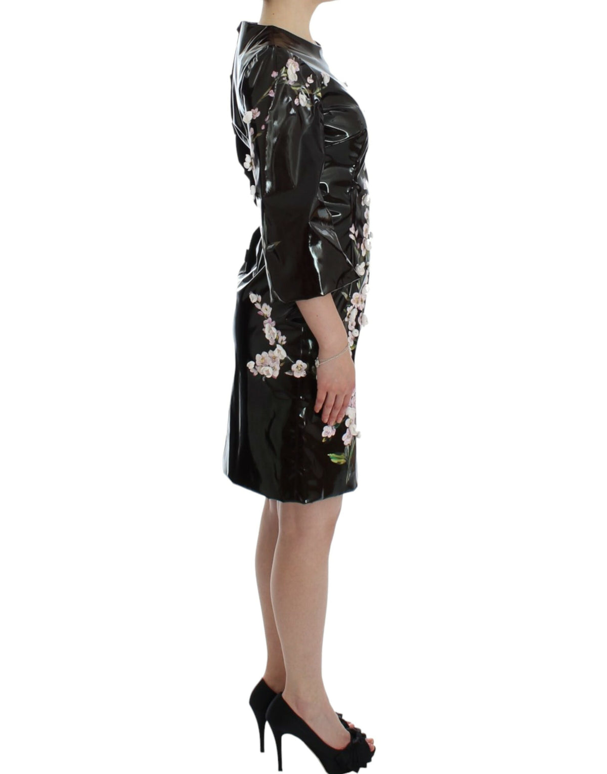 Dolce & Gabbana black floral 3/4 sleeve sheath dress displayed on a hanger with a close-up of the fabric and floral pattern.
