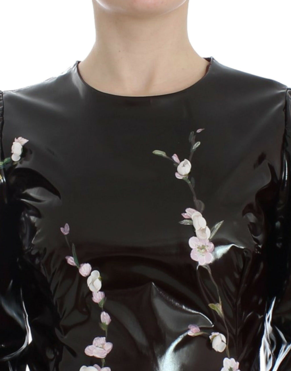 Dolce & Gabbana black floral 3/4 sleeve sheath dress displayed on a mannequin, featuring elegant floral print and fitted silhouette.