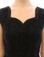 Dolce & Gabbana black floral lace Sicily runway dress displayed on a model with intricate lace detailing and elegant silhouette.