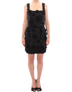 Dolce & Gabbana black floral dress with crystal embellishments, showcasing elegant fabric and intricate design details.
