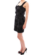 Dolce & Gabbana black floral dress with crystal embellishments, featuring a fitted silhouette and elegant design.