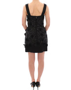 Dolce & Gabbana black floral dress with crystal embellishments, featuring a fitted silhouette and elegant design.