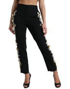 Dolce & Gabbana black floral applique high waist tapered pants with elegant design and tailored fit.