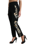 Dolce & Gabbana black floral applique high waist tapered pants with a stylish, fitted design and floral details.