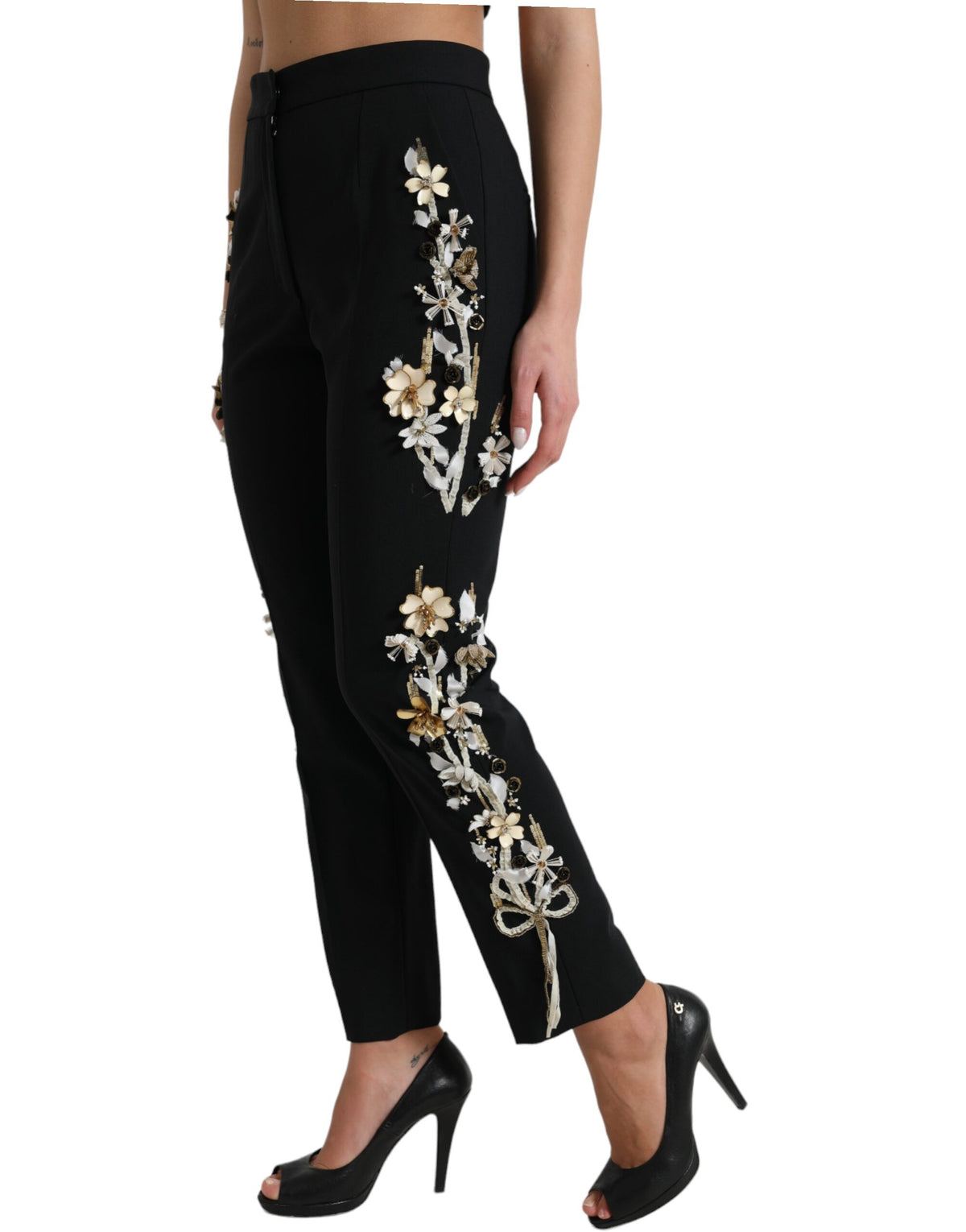 Dolce & Gabbana black floral applique high waist tapered pants with a stylish, fitted design and floral details.