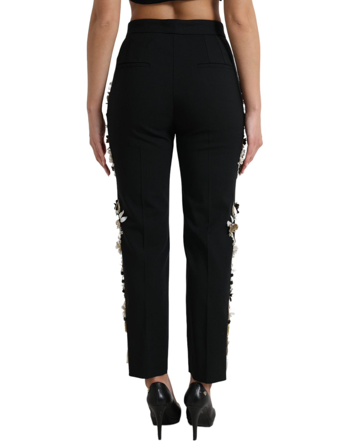 Dolce & Gabbana black floral applique high waist tapered pants with elegant floral details and tailored fit.