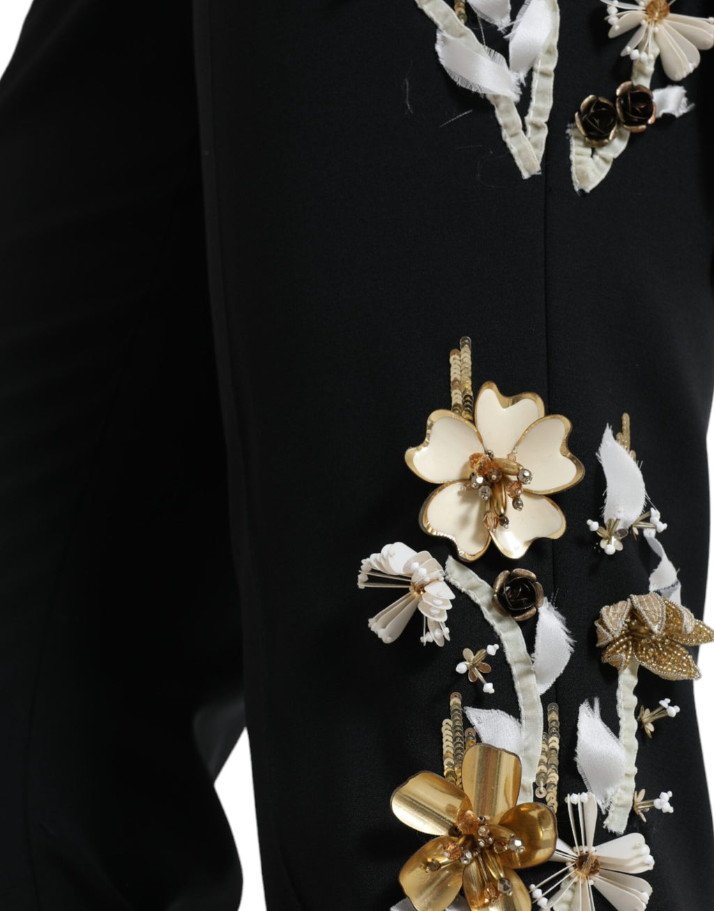 Black floral applique high waist tapered pants by Dolce & Gabbana with elegant design and tailored fit.