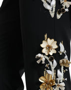 Black floral applique high waist tapered pants by Dolce & Gabbana with elegant design and tailored fit.