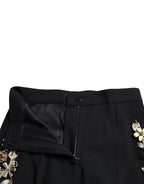 Dolce & Gabbana black floral applique high waist tapered pants with elegant design and tailored fit.