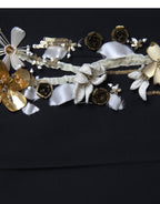Black floral applique high-waist tapered pants by Dolce & Gabbana featuring elegant floral embroidery and tailored fit.