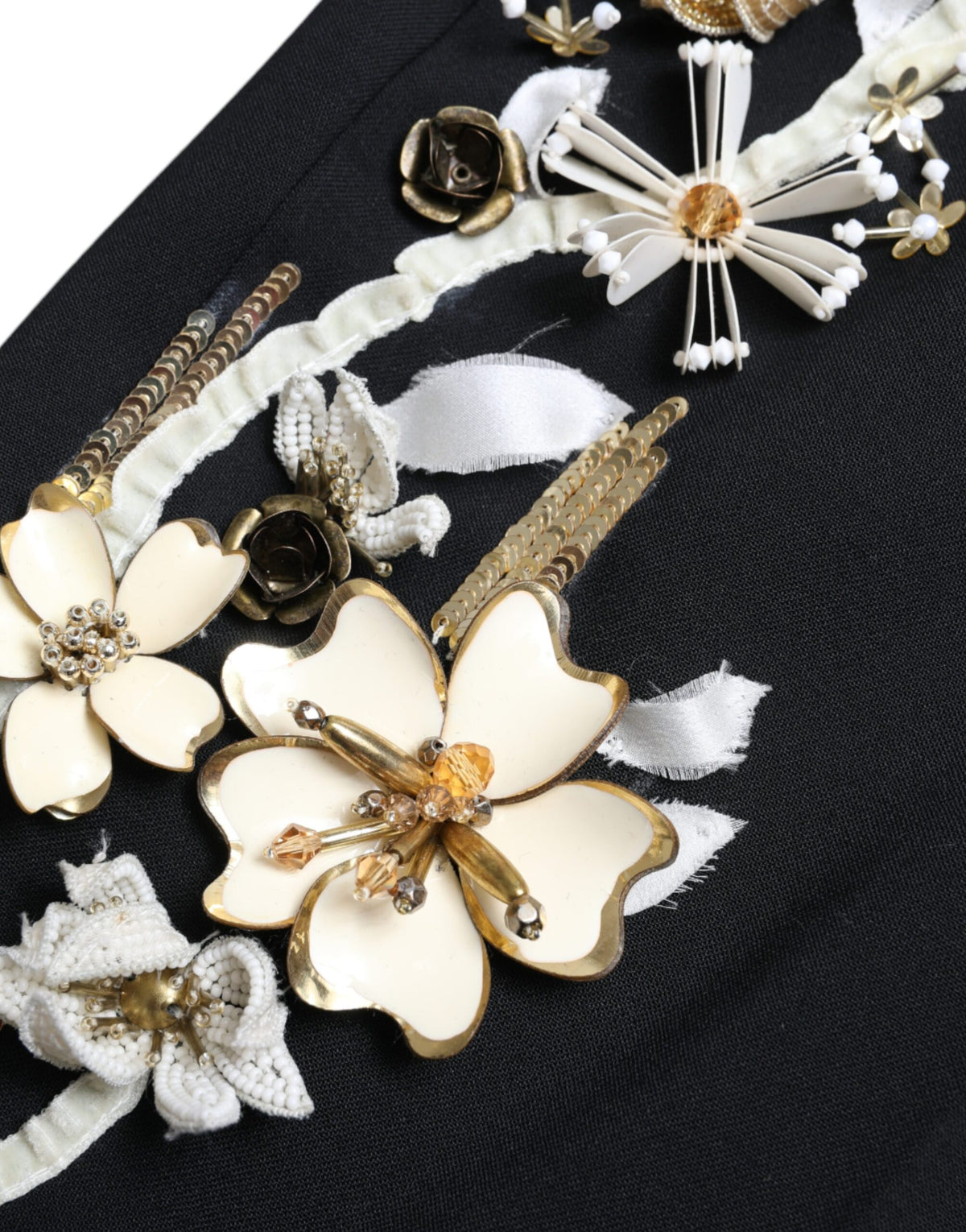 Black floral applique high waist tapered pants by Dolce & Gabbana with elegant floral details and tailored fit.