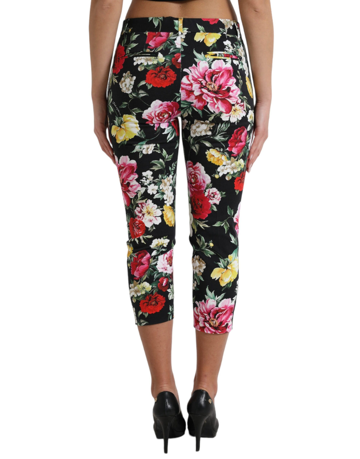 Dolce & Gabbana black floral print mid-waist cropped pants laid flat on a white background.