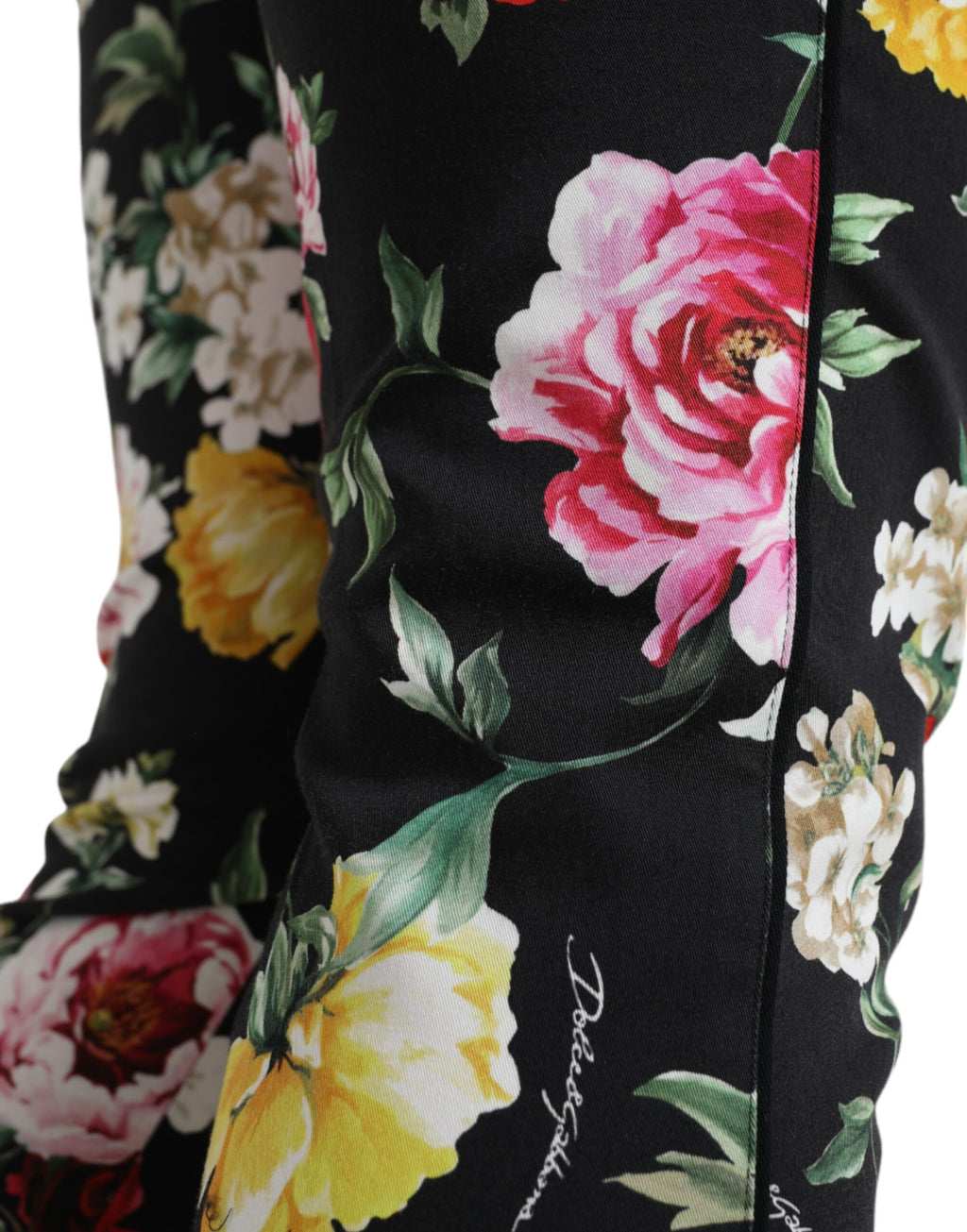 Dolce & Gabbana black floral print mid waist cropped pants displayed on a model.