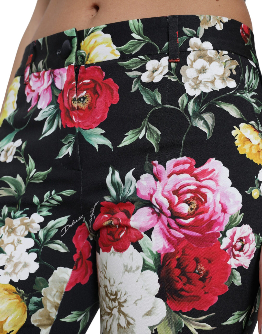 Dolce & Gabbana black floral print mid-waist cropped pants displayed on a model.