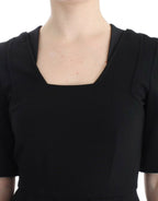 CO|TE Black short sleeve venus dress
