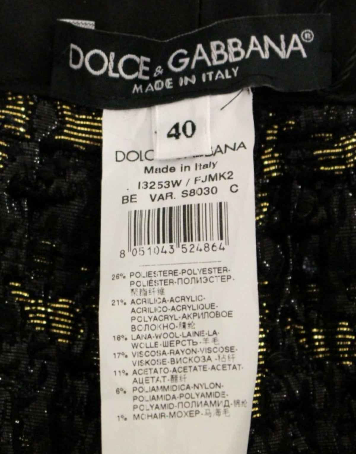 Black fabric shorts and pants by Dolce & Gabbana, featuring a stylish and tailored design with a sleek appearance.