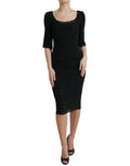 Dolce & Gabbana black floral lace viscose bodycon midi dress displayed on a hanger with intricate lace details.