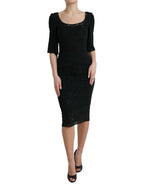 Dolce & Gabbana black floral lace viscose bodycon midi dress displayed on a hanger with intricate lace details.